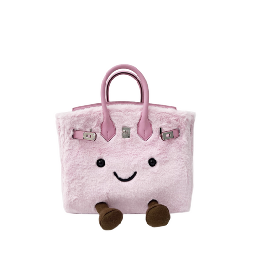 Pink plush bag with a smiley face and brown feet on a white background, featuring the brand Jellykin