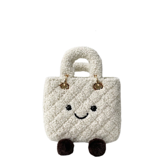 Small plush bag with a smiley face on a white background, featuring the brand jellykin